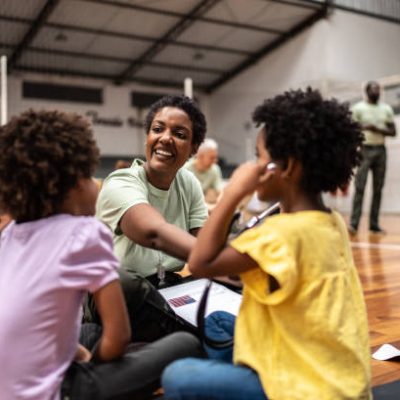 Army doctor playing with refugee children